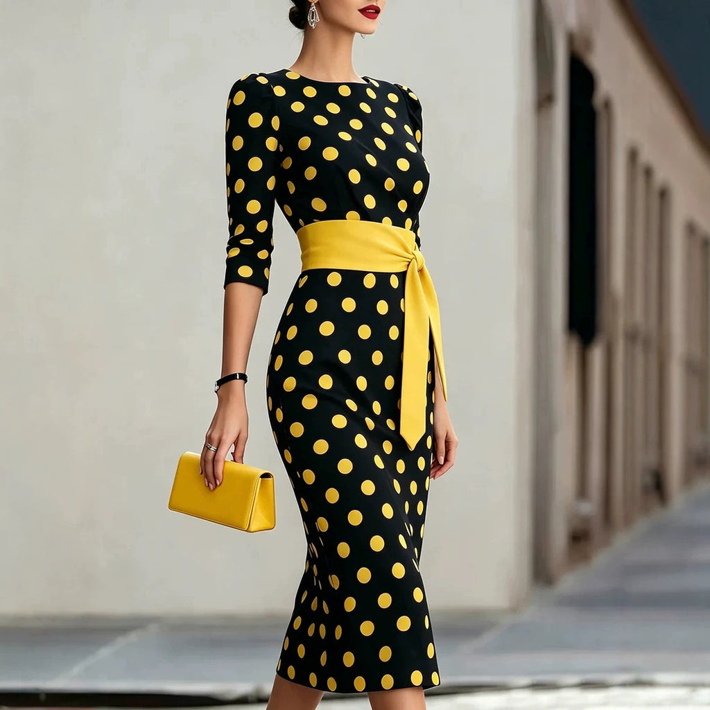Abito elegante aderente in vita, blu navy a pois in stile retrò, con cintura.