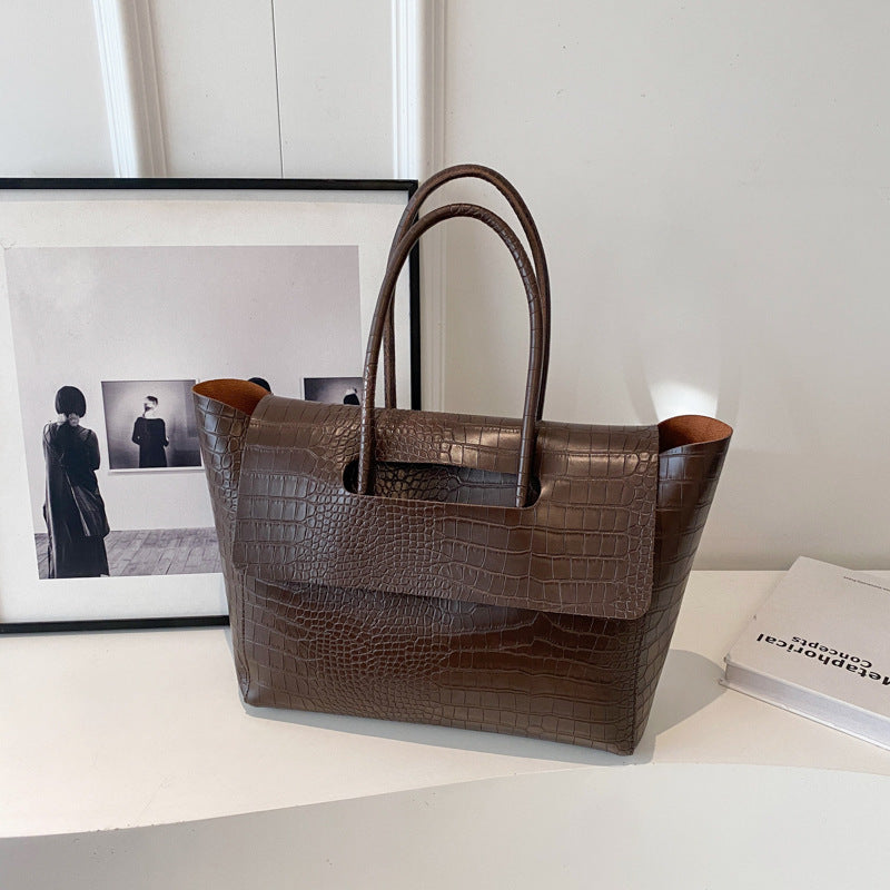 Nuova borsa a mano capiente con motivo a pietra