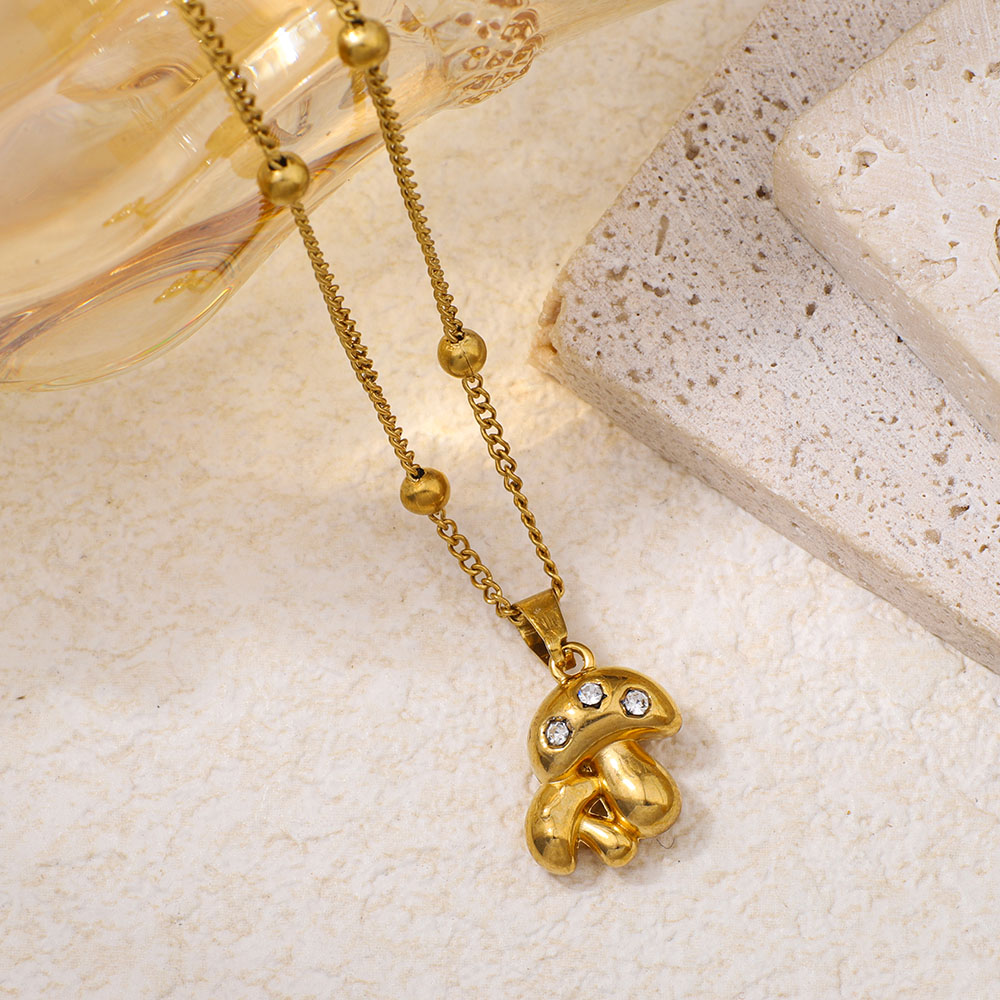 Collana con pendente a forma di fungo in acciaio inossidabile con strass intarsiati